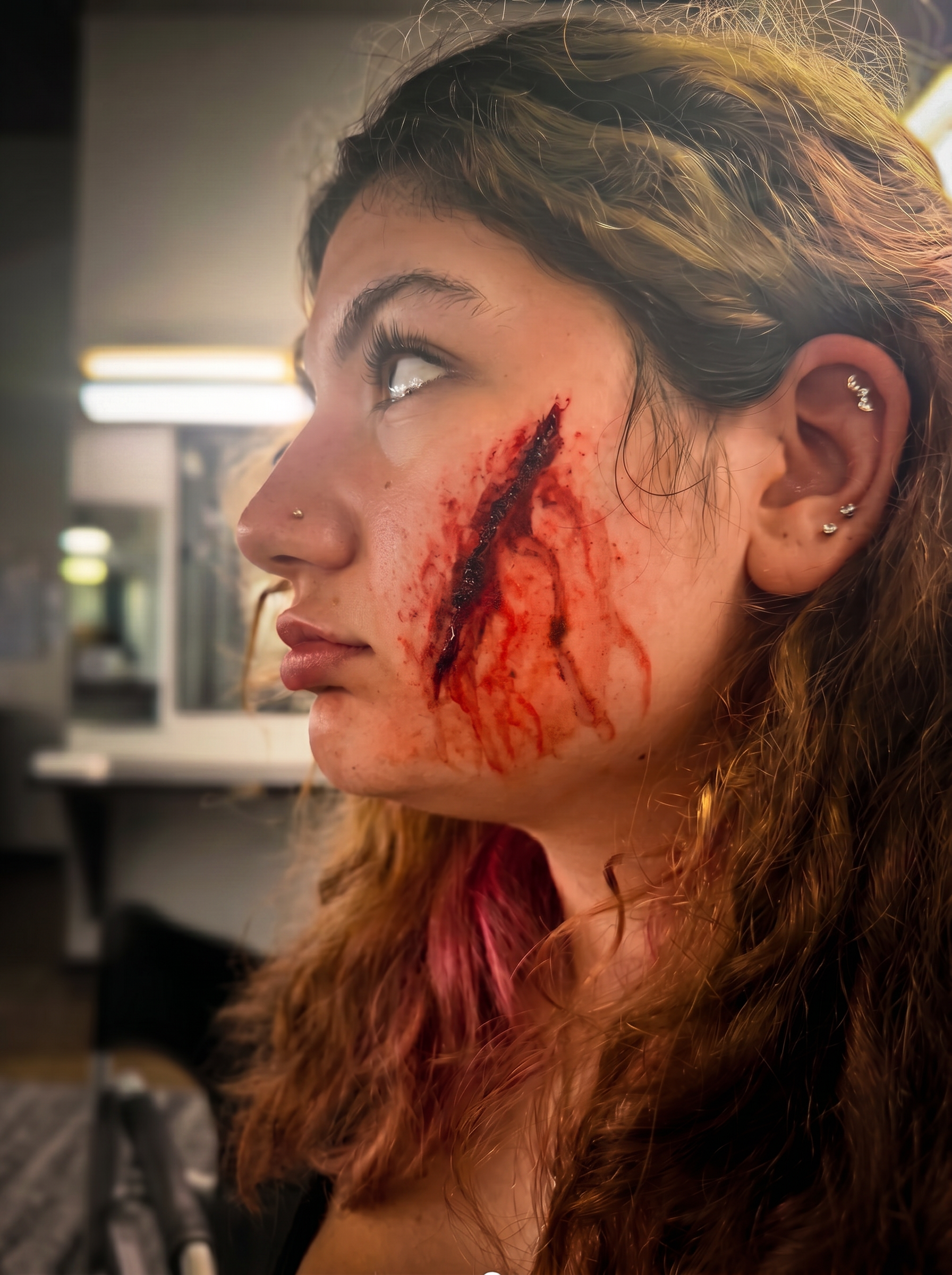 Facial slash wound on live model